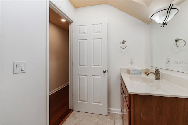 13554 NW 7th Rd, Newberry, FL 32669 - bathroom featuring vanity, vaulted ceiling, and tile patterned flooring