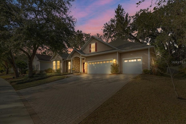 13554 NW 7th Rd, Newberry, FL 32669 - traditional-style house featuring decorative driveway and a garage