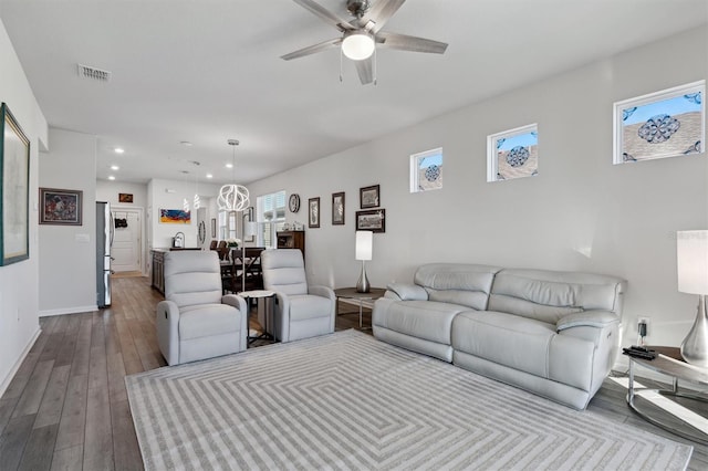 living room with light wood-type flooring and ceiling fan