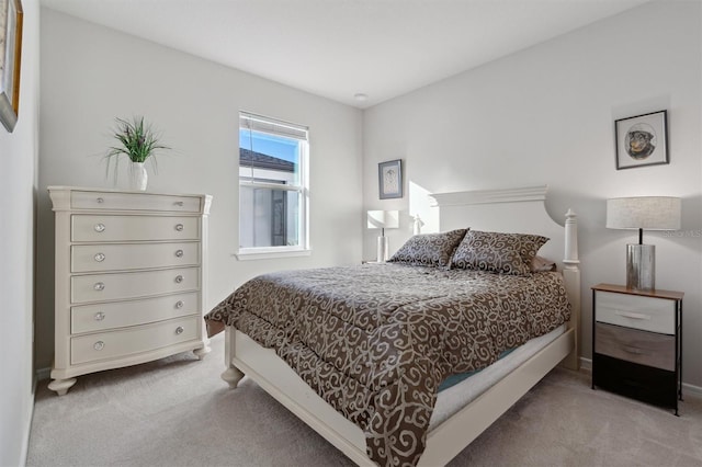 bedroom with light colored carpet