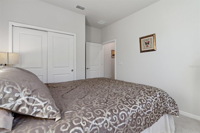 carpeted bedroom with a closet