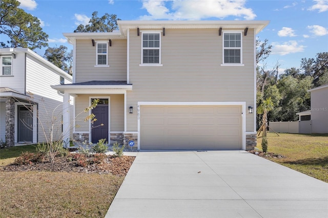 view of front facade with a front yard and a garage