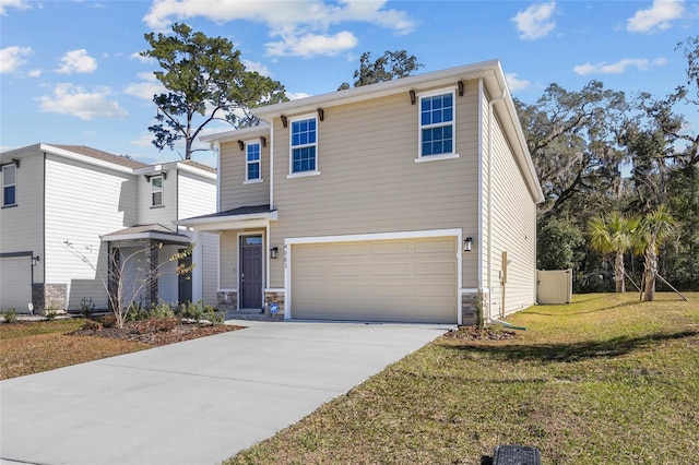 view of front of property with a front lawn and a garage