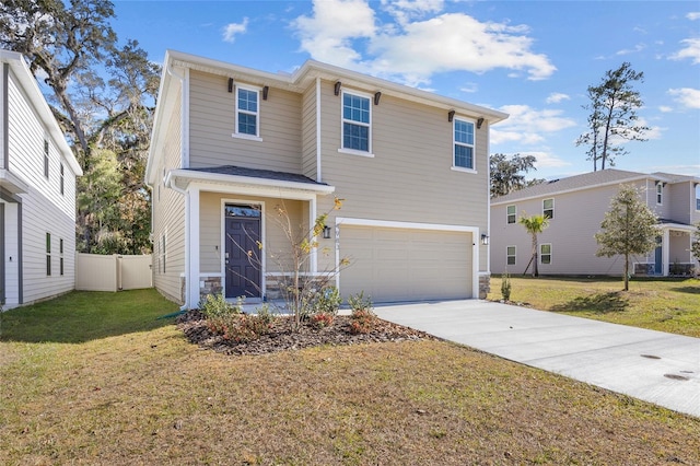 view of front of house with a front yard and a garage