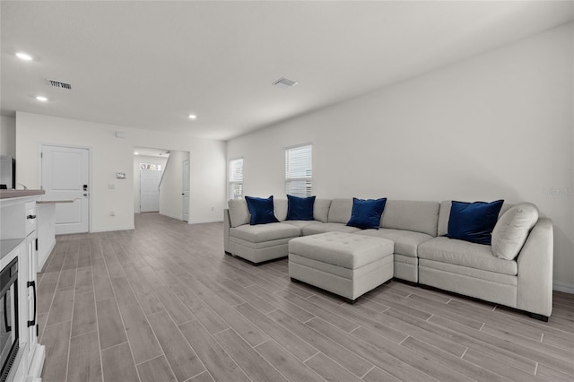 living room featuring light wood-type flooring