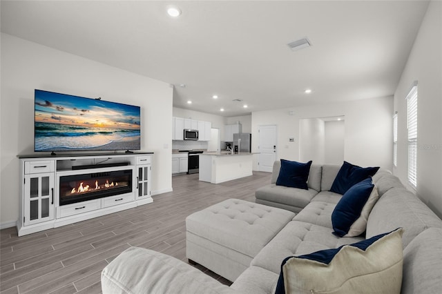 living room with light hardwood / wood-style floors