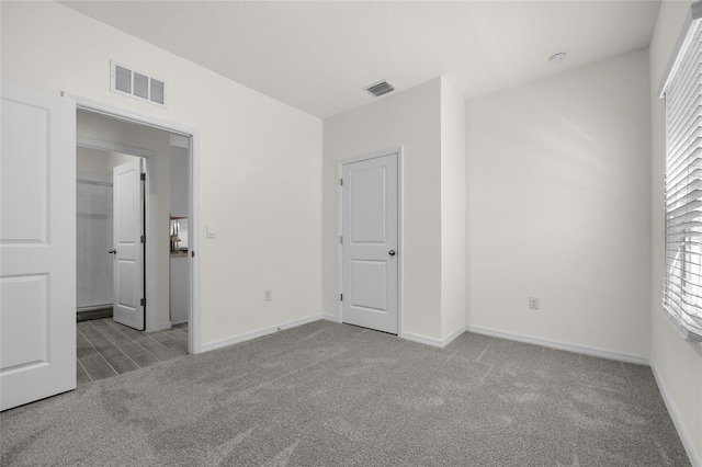 unfurnished bedroom with light carpet