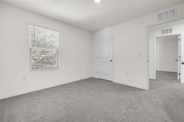 unfurnished bedroom featuring light colored carpet