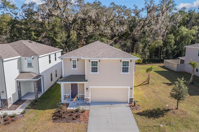 front of property featuring a garage, a porch, and a front lawn