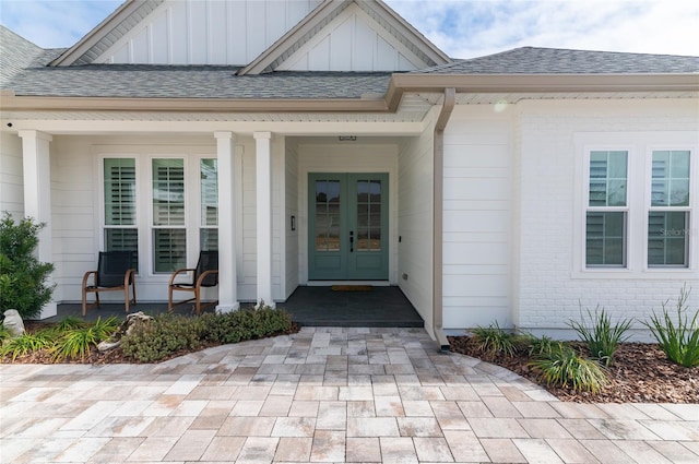 property entrance with a porch and french doors