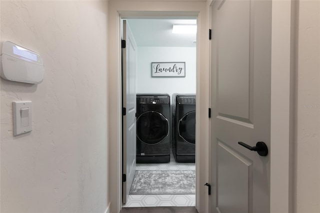 laundry room with independent washer and dryer