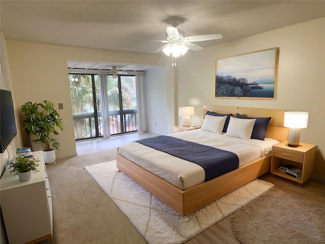 bedroom featuring ceiling fan and access to exterior