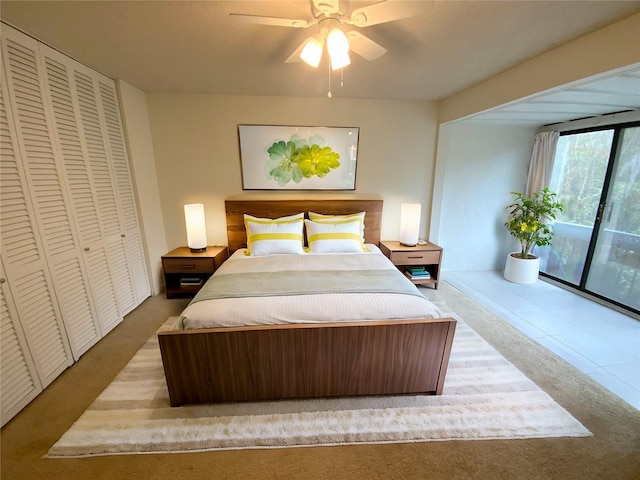 carpeted bedroom featuring ceiling fan, a closet, and access to exterior