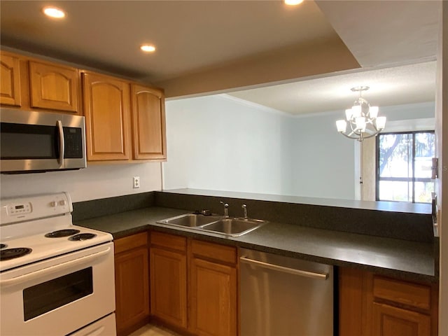 kitchen featuring sink, pendant lighting, stainless steel appliances, and an inviting chandelier