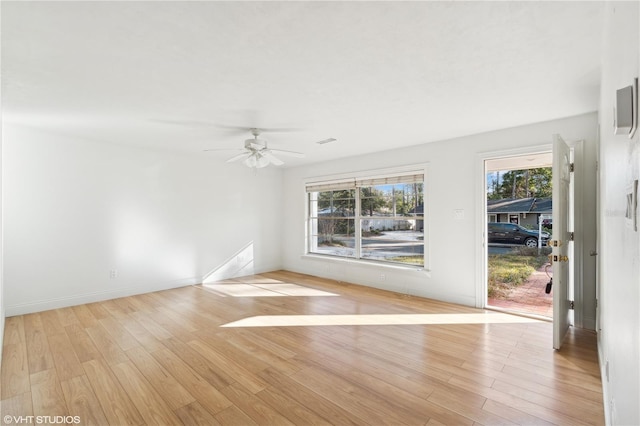 unfurnished room with light hardwood / wood-style flooring and ceiling fan