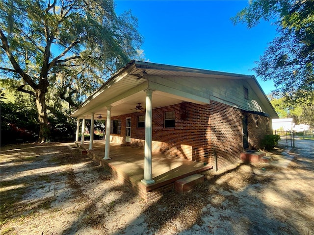 view of side of home featuring ceiling fan