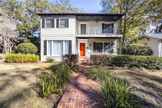 view of front of home with a balcony