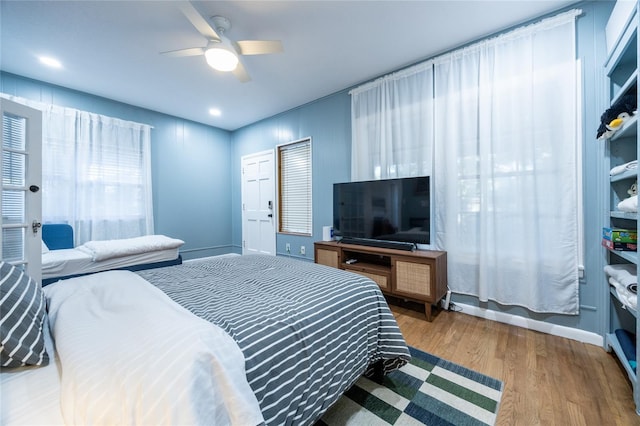 bedroom featuring ceiling fan and hardwood / wood-style floors