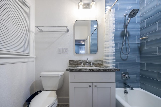 full bathroom with vanity, toilet, and shower / bath combo with shower curtain