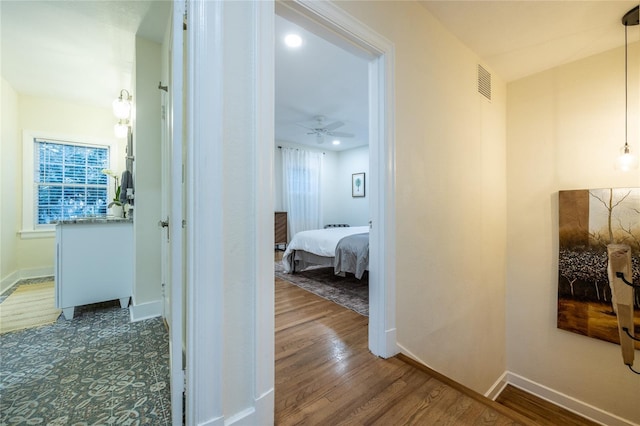 hallway with dark wood-type flooring