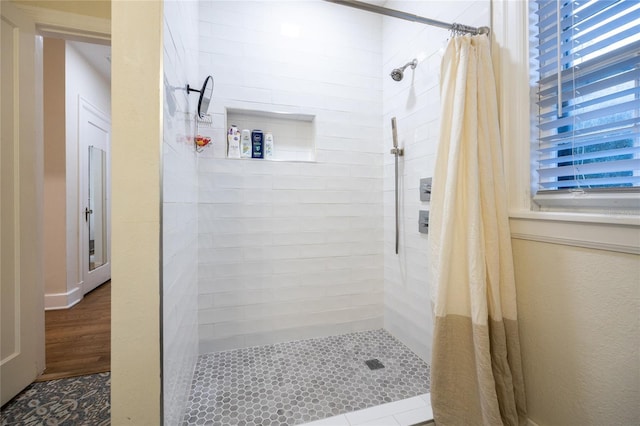 bathroom featuring a shower with curtain