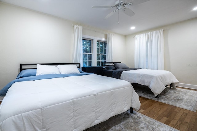 bedroom with hardwood / wood-style flooring and ceiling fan