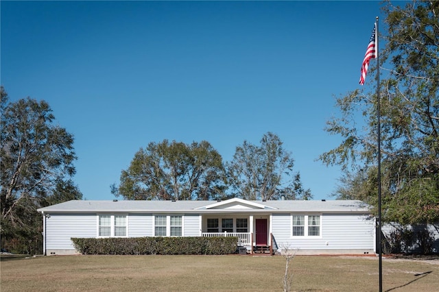 single story home with covered porch and a front yard