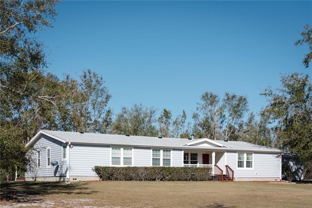 single story home with a front lawn and covered porch