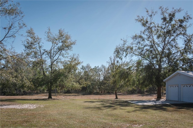 view of yard featuring a garage