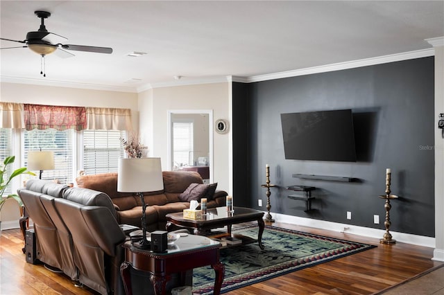 living room with ceiling fan, wood-type flooring, and ornamental molding