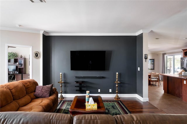 living room with hardwood / wood-style floors and ornamental molding