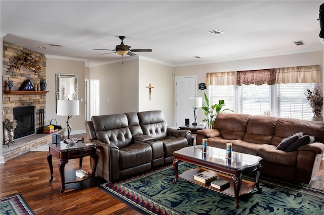 living room featuring a fireplace, ceiling fan, dark hardwood / wood-style flooring, and crown molding