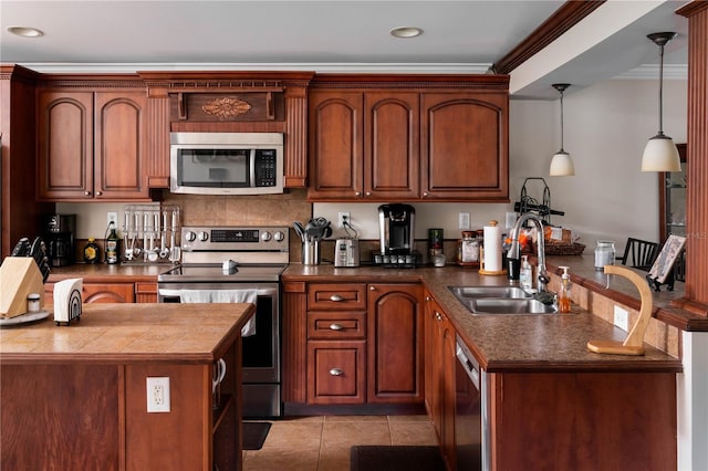 kitchen with crown molding, sink, hanging light fixtures, light tile patterned floors, and stainless steel appliances