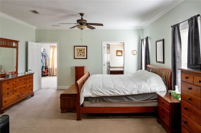 carpeted bedroom with connected bathroom, ceiling fan, and crown molding