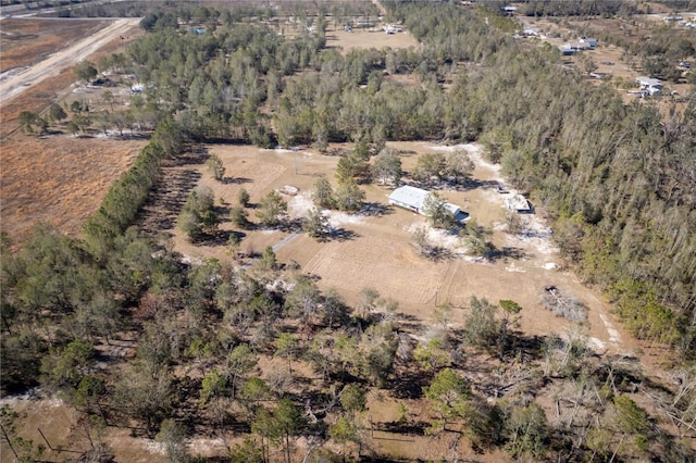 birds eye view of property with a rural view