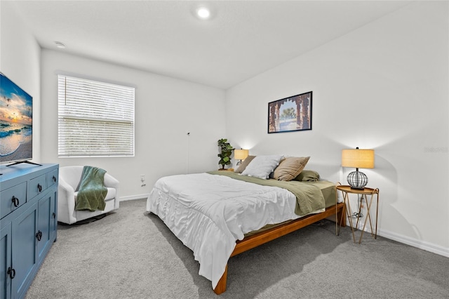 bedroom featuring light colored carpet