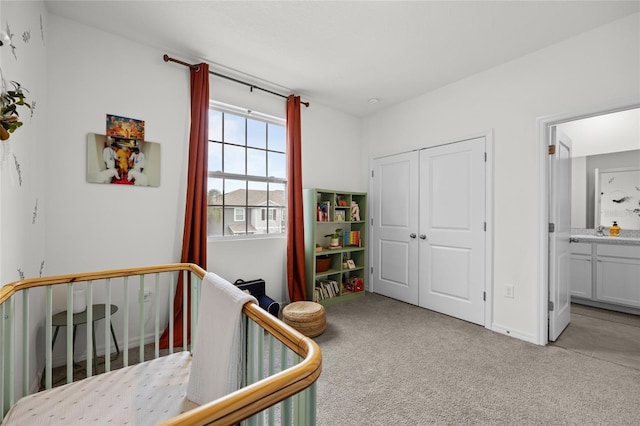 carpeted bedroom with ensuite bath