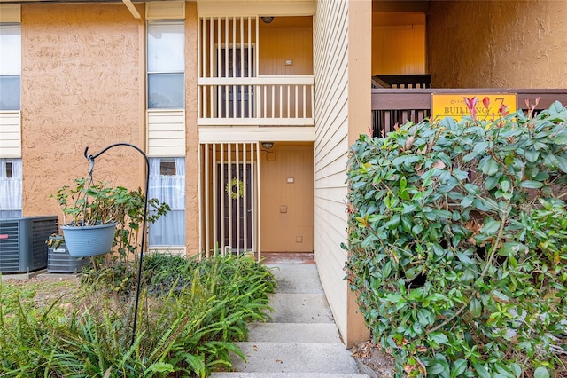 property entrance featuring cooling unit