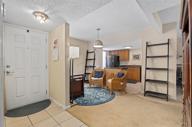 tiled entryway featuring sink