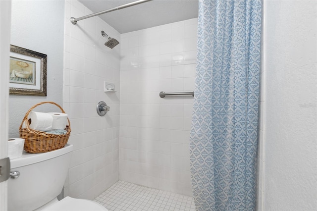 bathroom with toilet and curtained shower