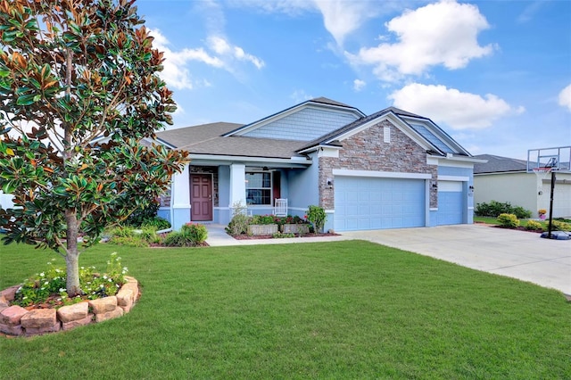 view of front of property with covered porch, a garage, and a front yard