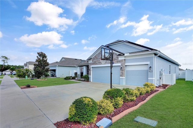 view of front of house with a garage and a front lawn