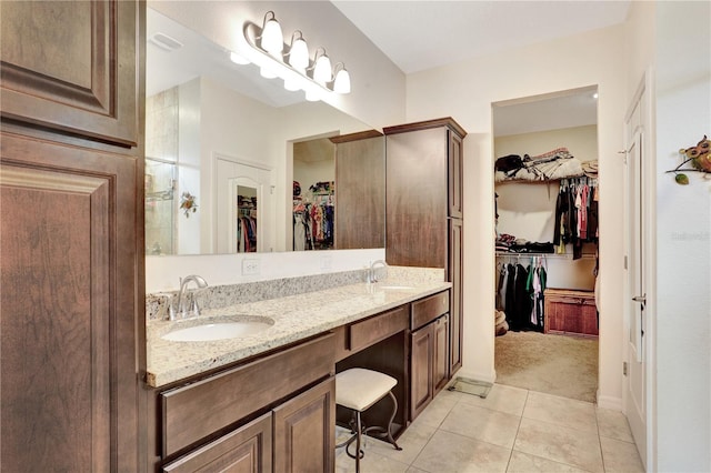 bathroom with tile patterned flooring and vanity