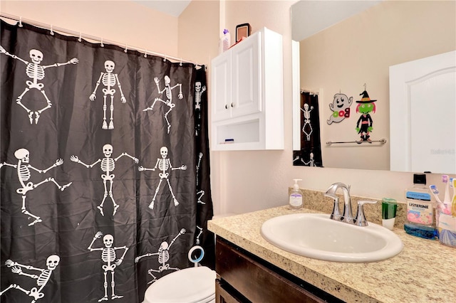 bathroom with vanity and toilet