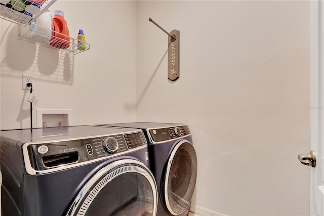 laundry room featuring washing machine and dryer