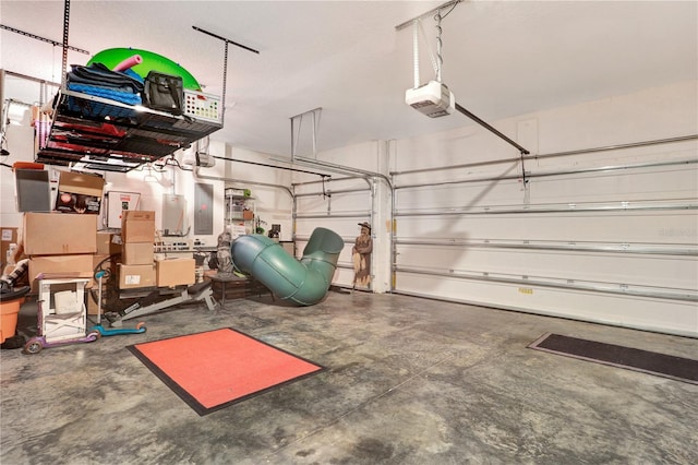 garage featuring electric panel and a garage door opener