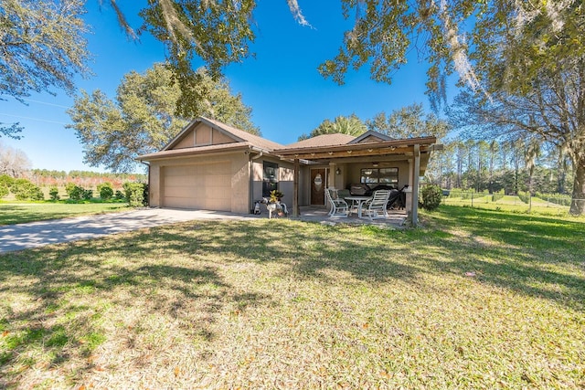 ranch-style home with a garage and a front lawn