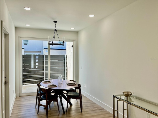 dining space with light wood-type flooring