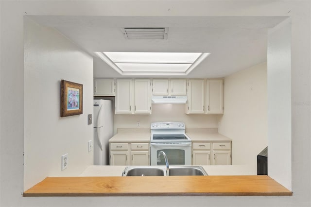 kitchen with white appliances and sink