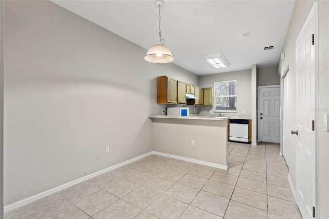 kitchen with pendant lighting, dishwasher, kitchen peninsula, and light tile patterned floors